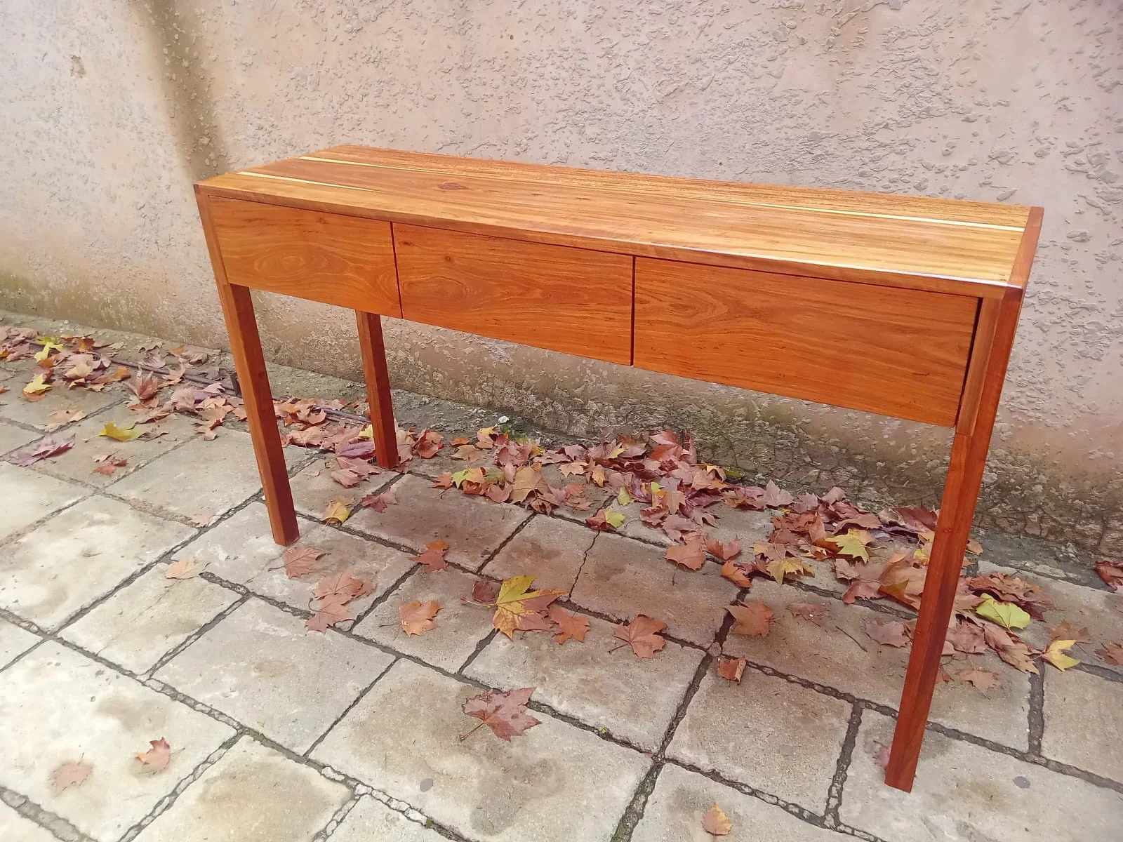 Dark walnut writing desk with leather inlay and brass hardware