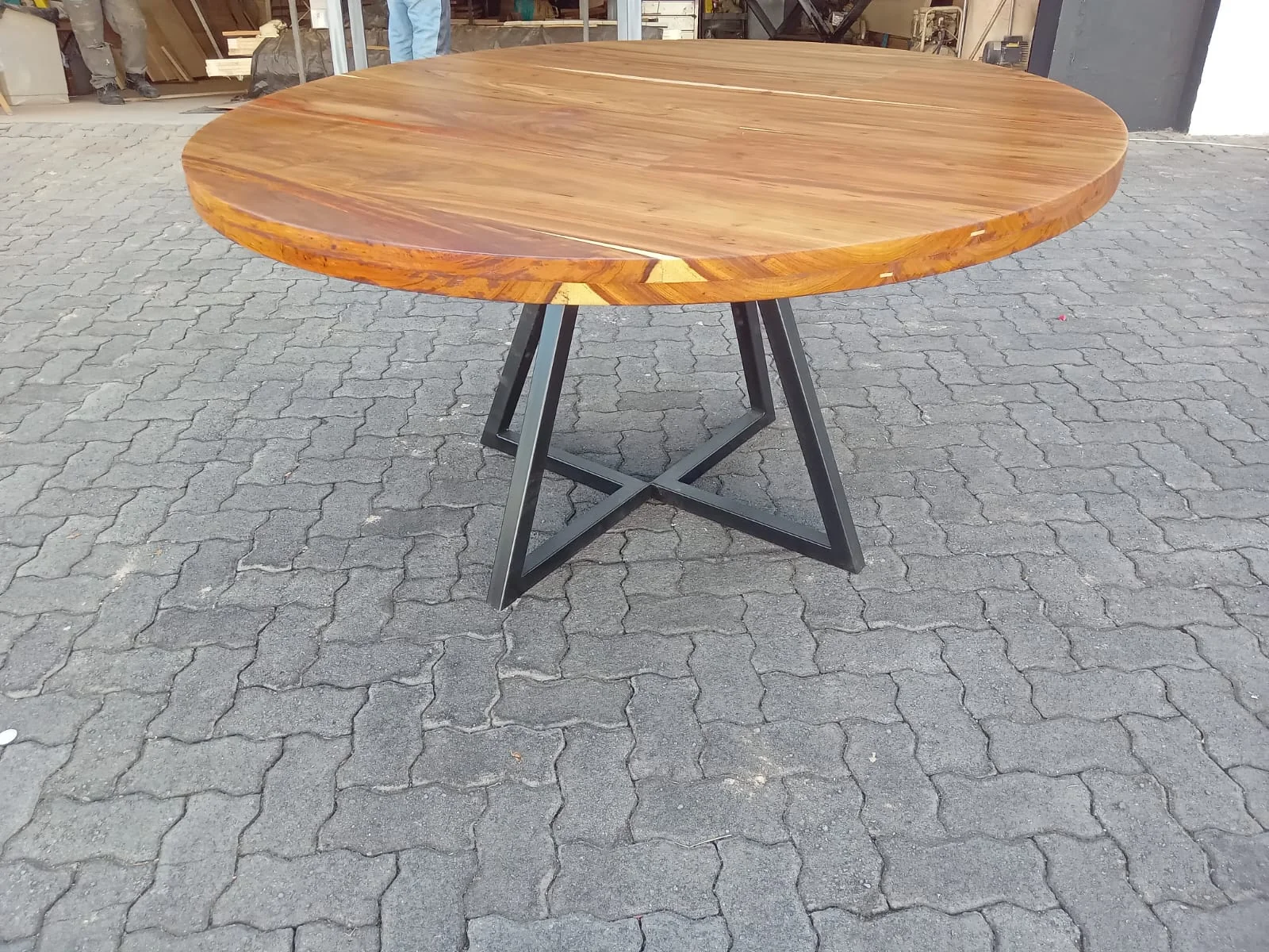Live-edge walnut dining table with natural bark edge in a bright dining room