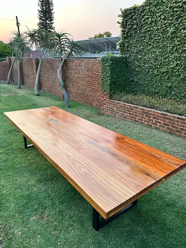 Minimalist white oak coffee table with tapered legs on a light rug